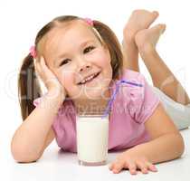Little girl with a glass of milk