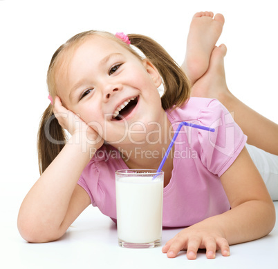 Cute little girl with a glass of milk