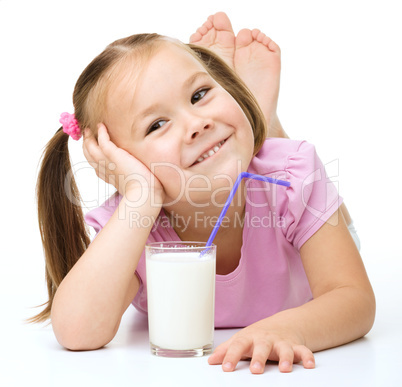 Cute little girl with a glass of milk