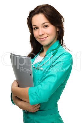 Portrait of a happy young woman doctor