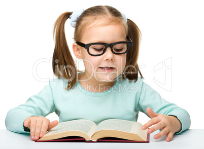 Cute little girl with books