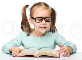 Cute little girl with books