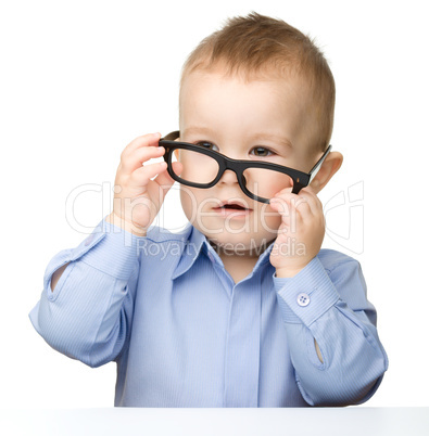 Portrait of a cute little boy wearing glasses