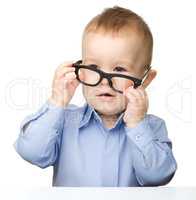 Portrait of a cute little boy wearing glasses