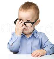 Portrait of a cute little boy wearing glasses