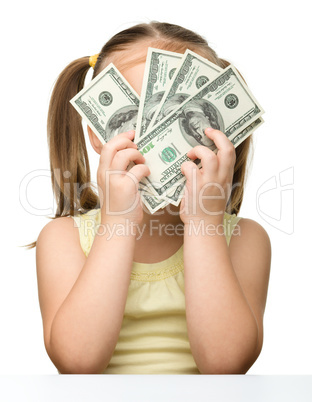 Cute little girl with dollars