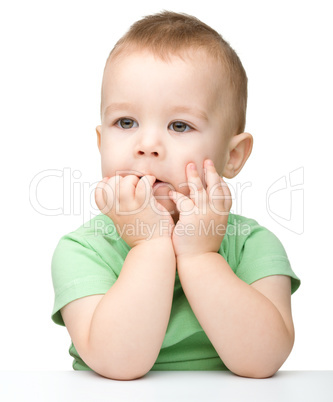 Portrait of a cute and pensive little boy