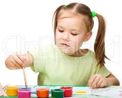 Cute cheerful child play with paints