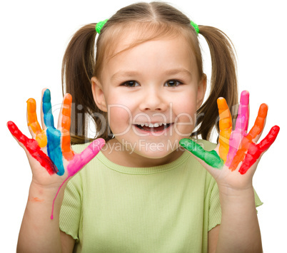 Portrait of a cute girl with painted hands