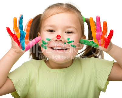 Portrait of a cute girl with painted hands