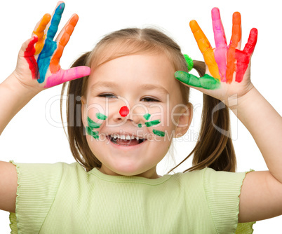 Cute cheerful girl with painted hands