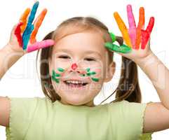 Cute cheerful girl with painted hands