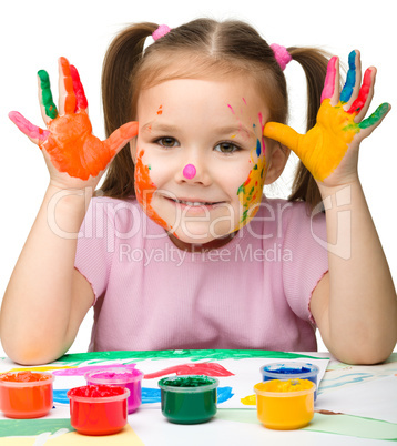 Cute cheerful girl with painted hands