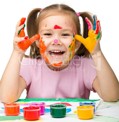 Cheerful girl with painted hands