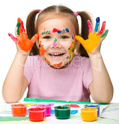 Portrait of a cute girl with painted hands