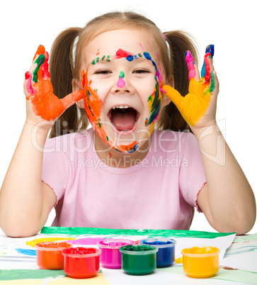 Cheerful girl with painted hands