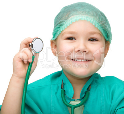 Little girl is playing doctor with stethoscope