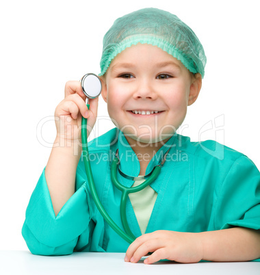 Little girl is playing doctor with stethoscope