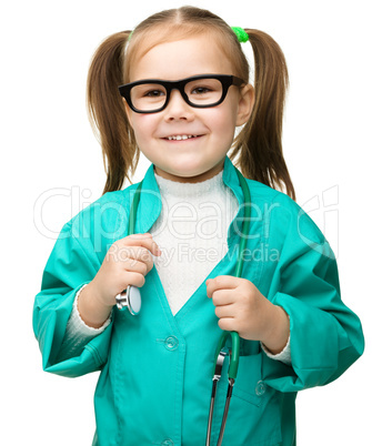 Cute little girl is playing doctor