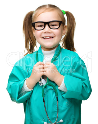 Cute little girl is playing doctor