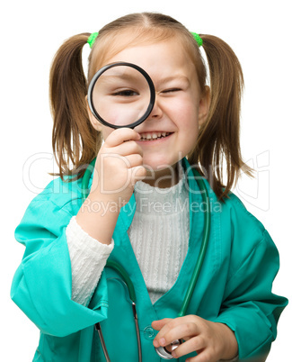 Cute little girl is playing doctor