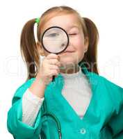 Little girl is playing doctor