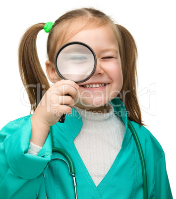 Cute little girl is playing doctor