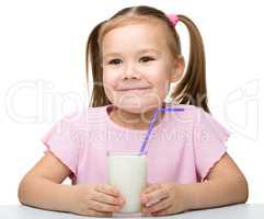 Cute little girl with a glass of milk