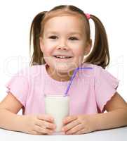 Cute little girl with a glass of milk