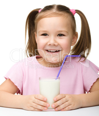 Cute little girl with a glass of milk