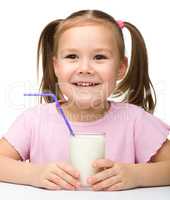 Cute little girl with a glass of milk