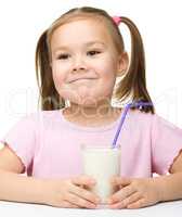 Cute little girl with a glass of milk