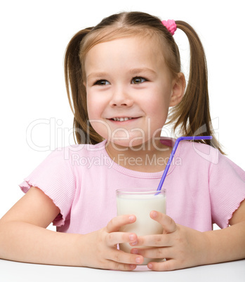 Cute little girl with a glass of milk