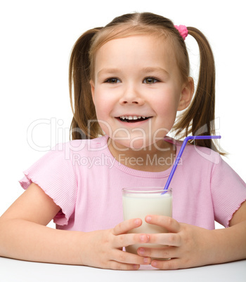 Cute little girl with a glass of milk