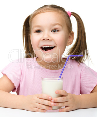 Cute little girl with a glass of milk