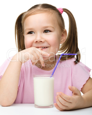 Cute little girl with a glass of milk