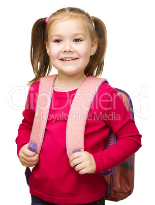 Portrait of a cute little schoolgirl with backpack