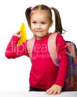 Portrait of a cute schoolgirl with backpack