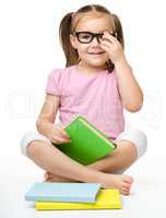 Cute little girl with books