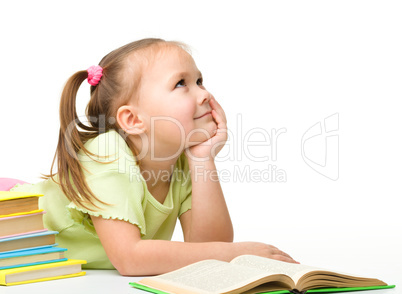 Cute little girl with books