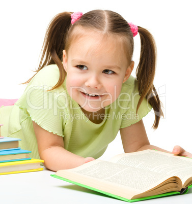 Cute little girl with books