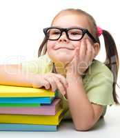 Cute little girl with books