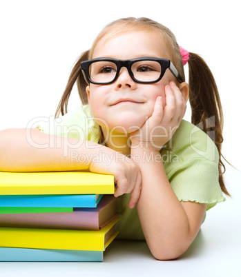 Little girl with books