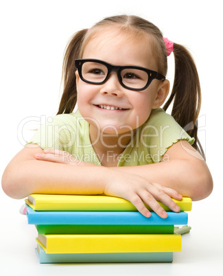 Cute little girl with books