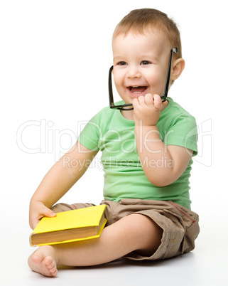 Cute little boy with book