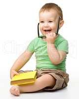 Cute little boy with book