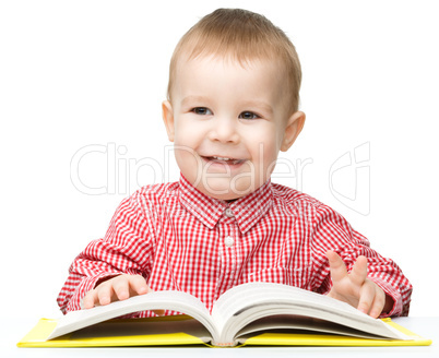 Little child play with book