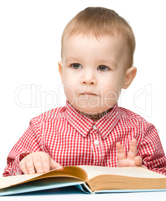 Little child play with book