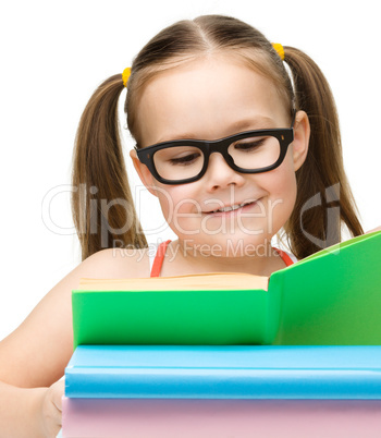 Cute little girl with books