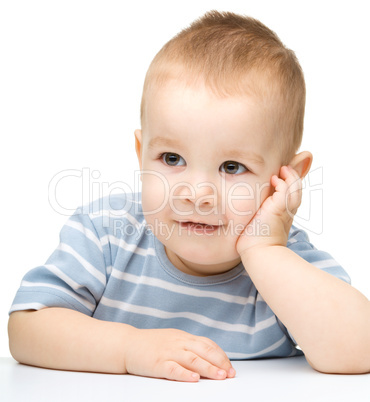 Portrait of a cute and pensive little boy